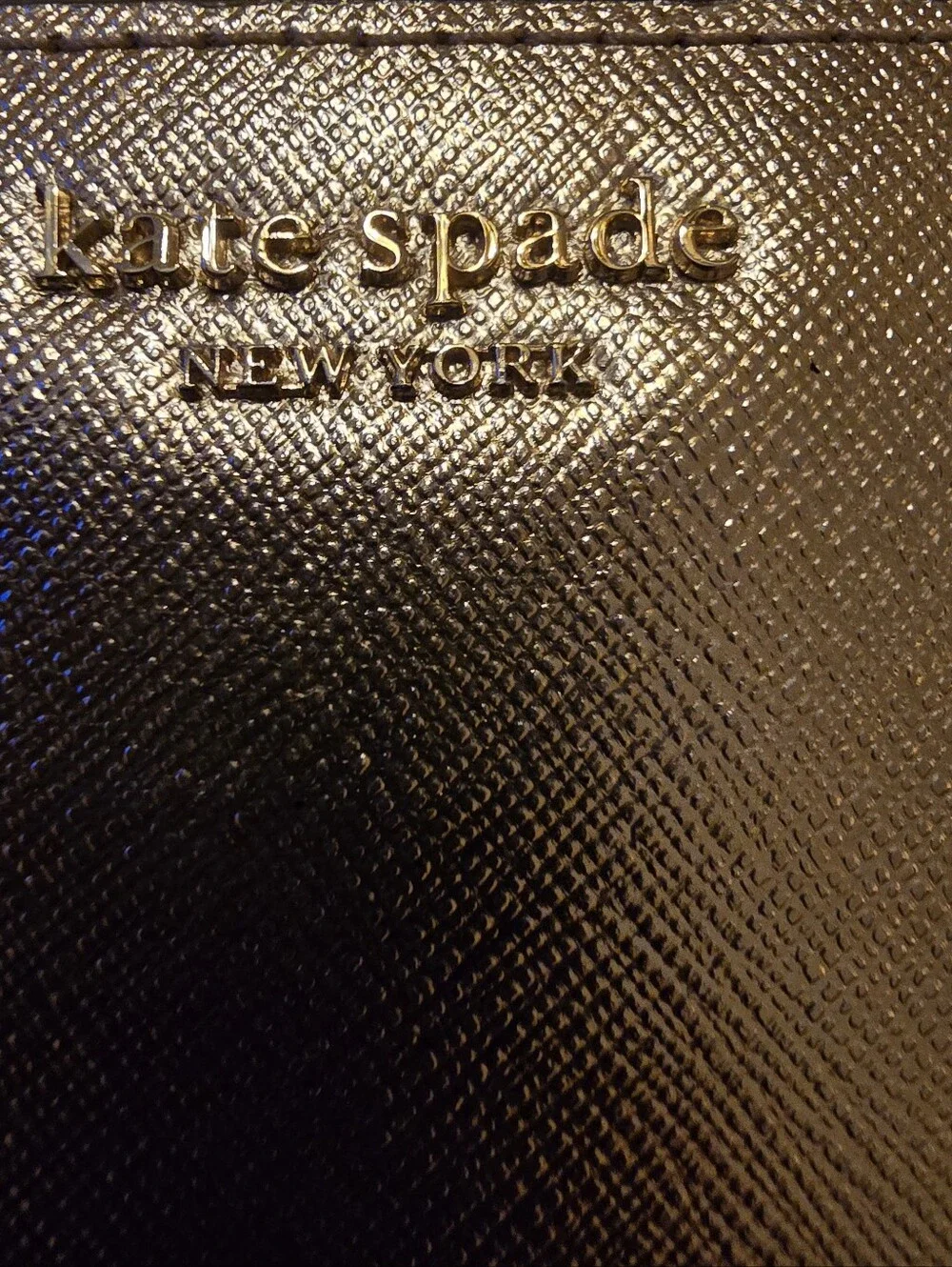 Kate Spade New York Staci small zip-around bifold wallet featuring a glittery ro